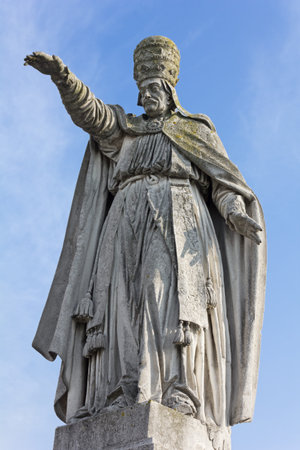 Statue of Pope Alexander VIII in Prato della Valle in Padua, Italy, against a blue skyの写真素材