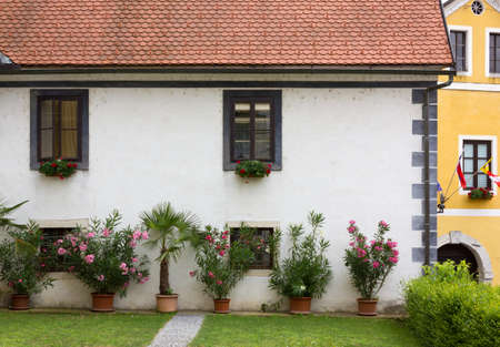 Facade of a flower decorated historic building in Sloveniaのeditorial素材