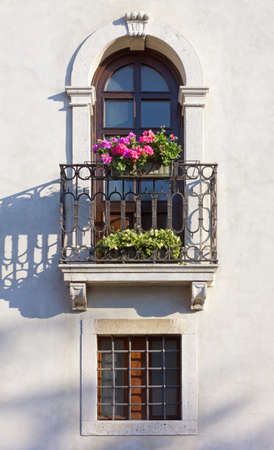 Flowered balcony and windows on a historic building's facadeのeditorial素材