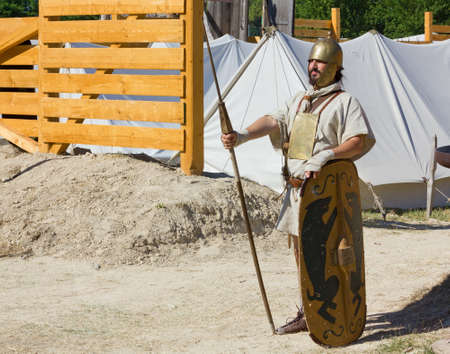 AQUILEIA, Italy - June 18, 2017 : Soldier guarding the entrance of an ancient roman military encampment at the local historical reenactmentのeditorial素材