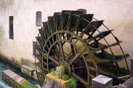 Close-up of an old watermill in action