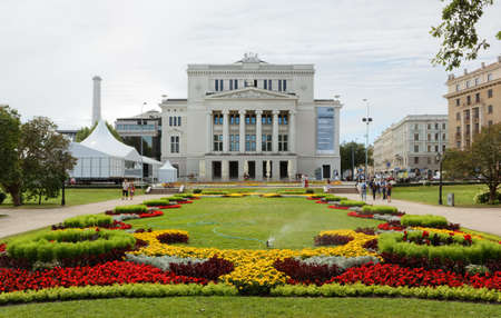 RIGA, Latvia - July 27, 2013: Latvian National Opera House and the beautiful flowerbed in frontのeditorial素材