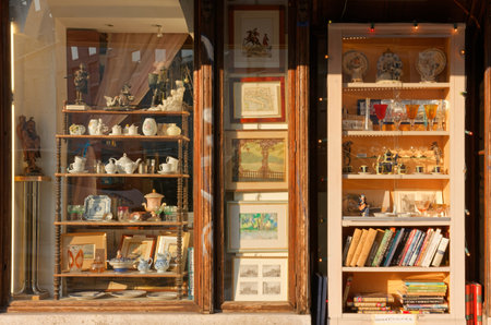 TRIESTE, Italy - March 25, 2022: Sunlit window of a famous antique shop in downtown Trieste