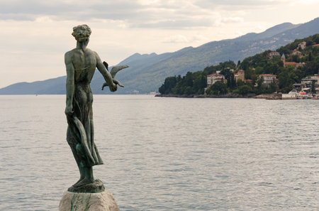 OPATIJA, Croatia - August 2, 2022: Statue of the Maiden with the Seagull, one of the town's symbols, beside Lungomare promenadeのeditorial素材