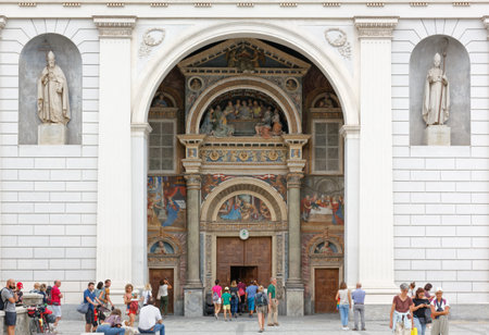 AOSTA, Italy - August 17, 2022: Facade of the Aosta cathedral crowded with visitorsのeditorial素材