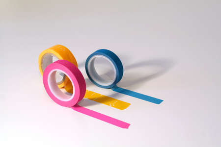 Washi tape rolls, masking tape rolls unrolled. Isolated on white backgroundの写真素材