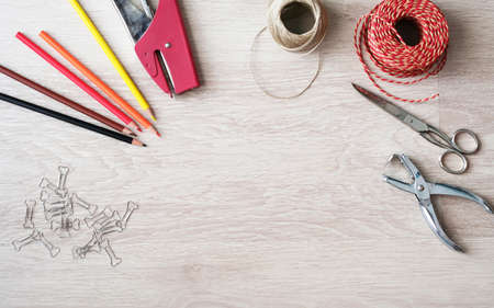 Desktop mockup, top view, with colorful stationery and central copy space, on wooden backgroundの写真素材