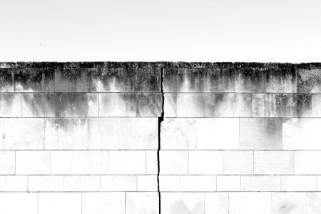 Broken brick wall in black and white. Abstract background for design.の写真素材