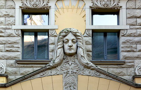 Sculpture of a woman on the facade of the building