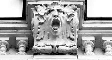 Portrait of a screaming lion on the facade of an old building