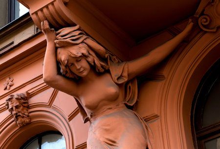 Sculpture of a woman on the facade of the building