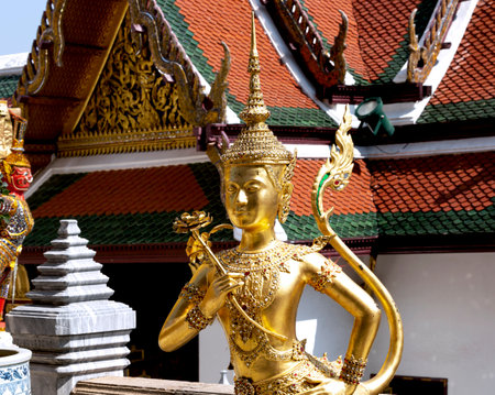 Golden angel statue in Wat Phra Kaew, Bangkok, Thailandの写真素材
