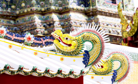 The dragon statue on the roof of the Buddhist temple. Thailand.の写真素材