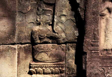 Ancient stone carving in Angkor Wat, Siem Reap, Cambodia