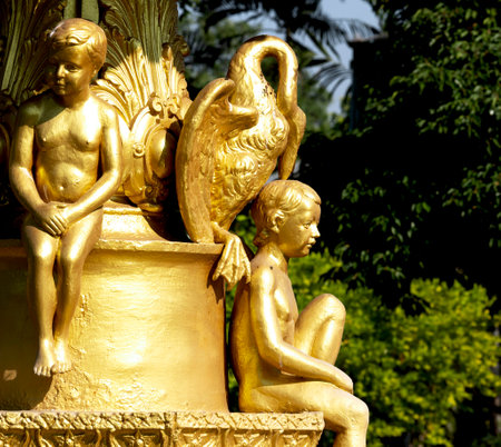 golden statue in the park, closeup of photoの写真素材