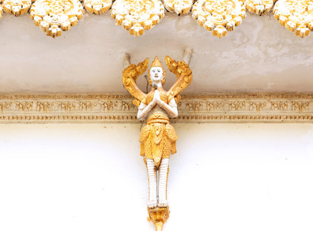 Thai style molding art on wall in temple, Thailand.の写真素材