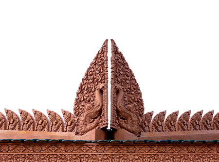 Thai style molding art on temple roof isolated on white backgroundの写真素材