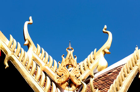 Thai temple roof with blue sky in Chiang Mai, Thailandの写真素材