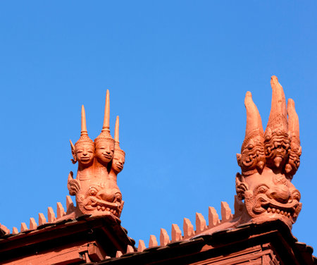 Thai style dragon statue on the roof of temple, Thailand.の写真素材