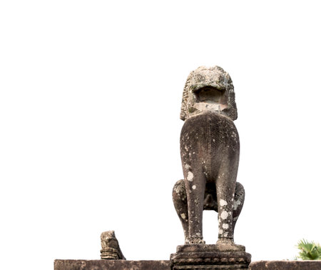 Statue of a lion on the top of an ancient templeの写真素材