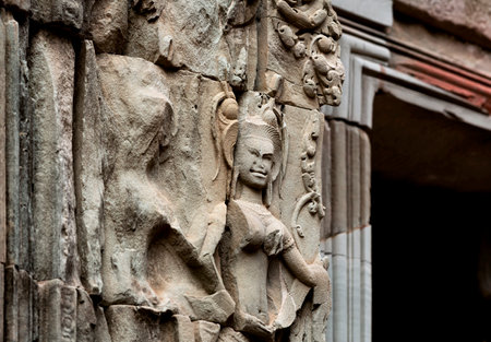 Sculpture on the facade of an ancient buildingの写真素材