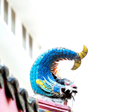 Colorful dragon statue on the roof of the temple, Thailand.の写真素材
