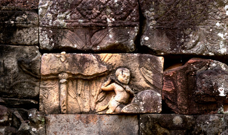 Ancient Khmer stone carvings on the wall of Preah Khan temple, Angkor, Cambodiaの写真素材