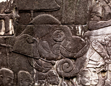 Stone carving on the wall of the Angkor Wat temple in Cambodiaの写真素材