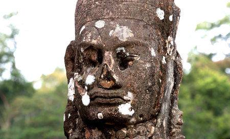 Stone carving of the face of a buddhaの写真素材