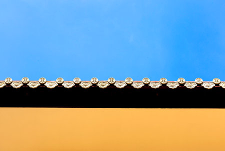 Roof of temple with blue sky background, Thailand. (Selective focus)の写真素材