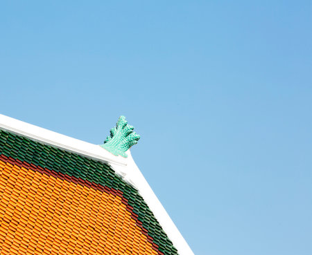 Roof of Thai temple with blue sky background, Bangkok, Thailandの写真素材