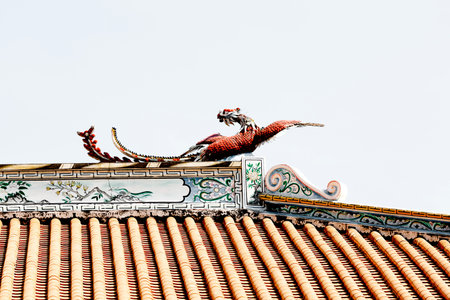 Chinese dragon statue on the roof of a temple, closeup of photoの写真素材
