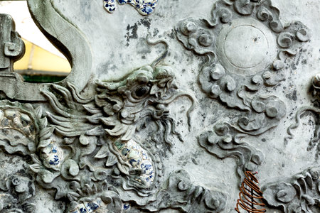 Close up of a stone carving in a Chinese temple, China.の写真素材