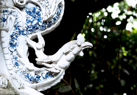 White dragon statue on the wall in the temple,Thailand.の写真素材