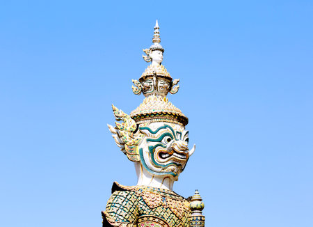 Giant statue on blue sky background, Wat Phra Kaewの写真素材