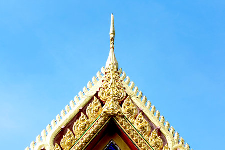Thai temple roof with blue sky background, Wat Phra Kaew, Bangkok, Thailandの写真素材