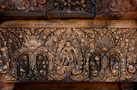Art carving on the wall at Khajuraho temple, India.の写真素材