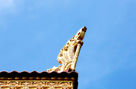 Thai style temple roof with blue sky background.の写真素材