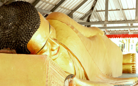Reclining Buddha image at Wat Muang, Angthong, Thailand.の写真素材
