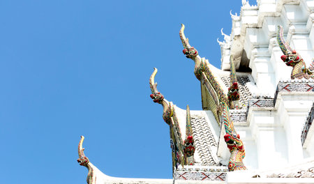 Thai temple roof with blue sky, Wat Phra Kaew, Bangkok, Thailandの写真素材