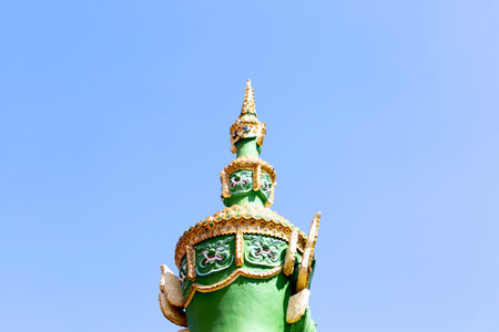 Thai style giant statue on blue sky background,Thailand.の写真素材