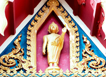 Buddha statue on the wall in Thai temple, Thailand.の写真素材