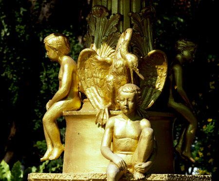 golden angel statue in the park, closeup of photo.の写真素材