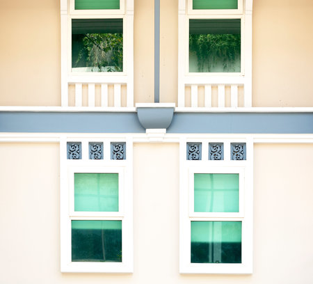 Windows on the wall of the building in the city, Thailand.