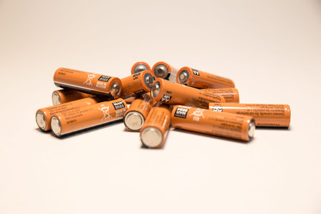 Close up on alkaline battery size AA over white background.