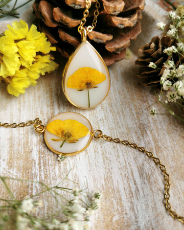 Women's jewelry for all occasions, yellow flower embedded in epoxy resinの写真素材