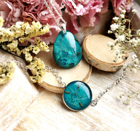 turquoise, blue handmade jewelry, dandelion embedded in epoxy resinの写真素材