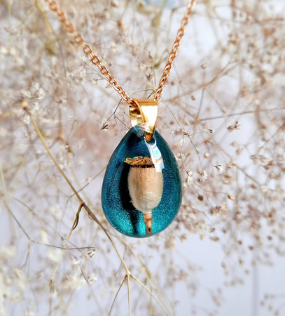 Handmade necklace with natural flower, amaizing turquoise blue color, epoxy resinの写真素材