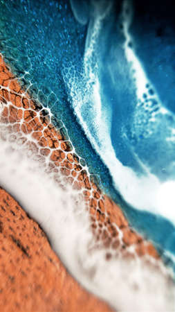 piece of your own ocean at home, epoxy resin on wood, waves on the shore of the oceanの写真素材