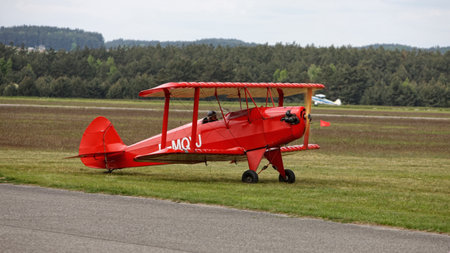 Aerobatic biplane on the airfieldの写真素材